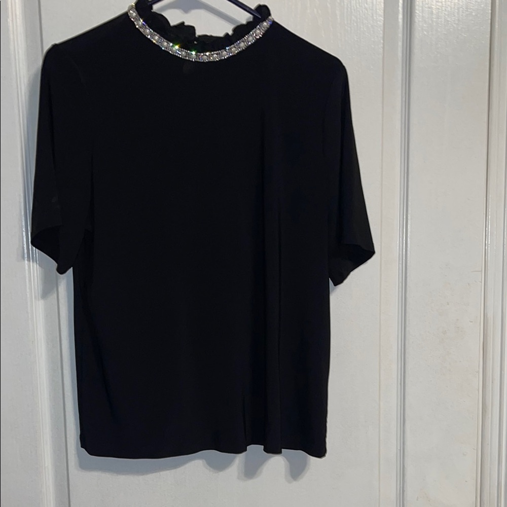 Elegant Black Top with Embellished Neckline